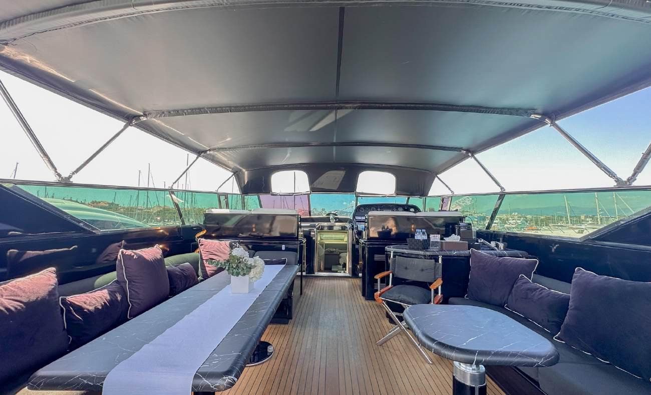 Aft deck dining setup with chairs and sofa