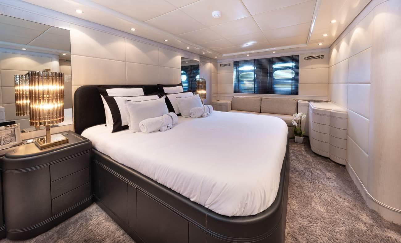 Master cabin suite with king-size bed and sofa