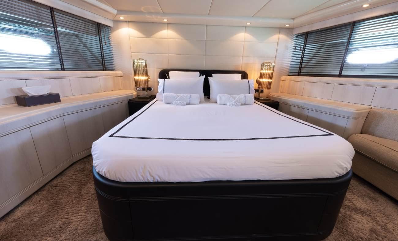 VIP cabin with double bed and light wood finishes