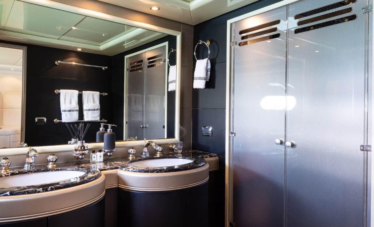 VIP ensuite bathroom with dual washbasins and shower