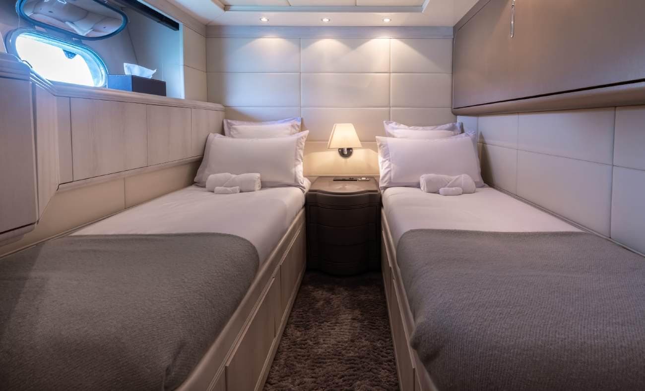 Twin cabin featuring twin single beds and premium bedding