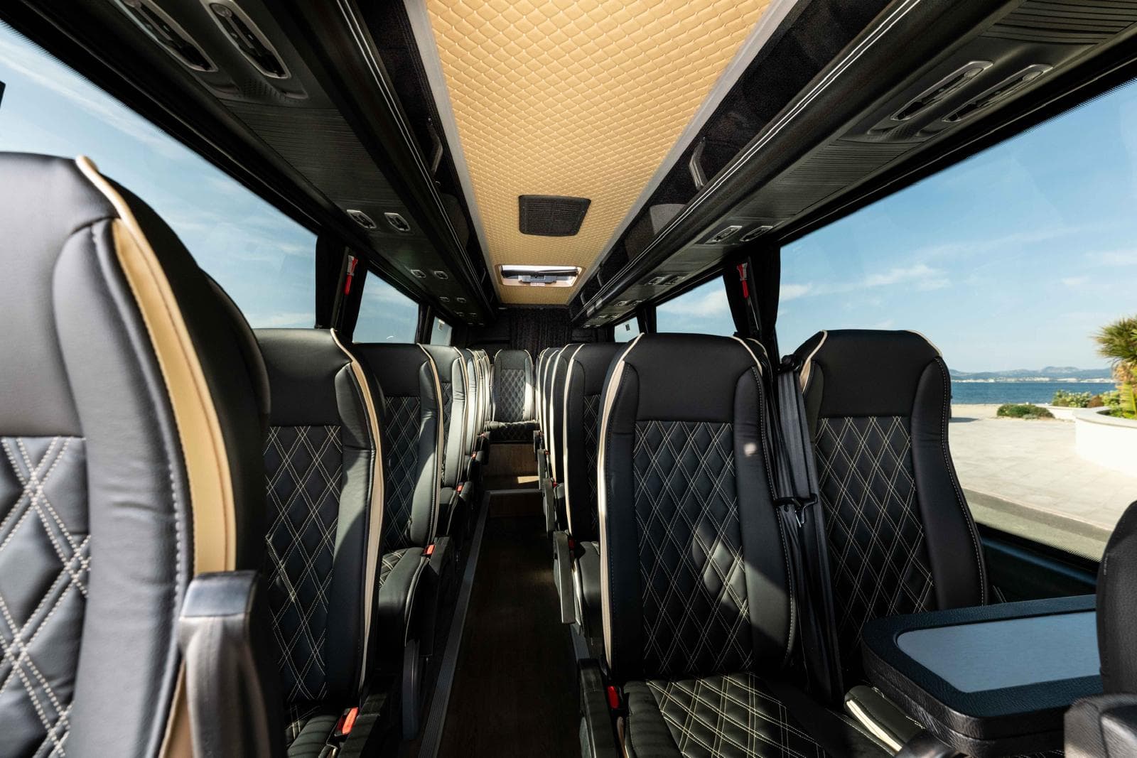 Luxury leather interior of the Mercedes Sprinter VIP with quilted seats for groups up to 20 passengers